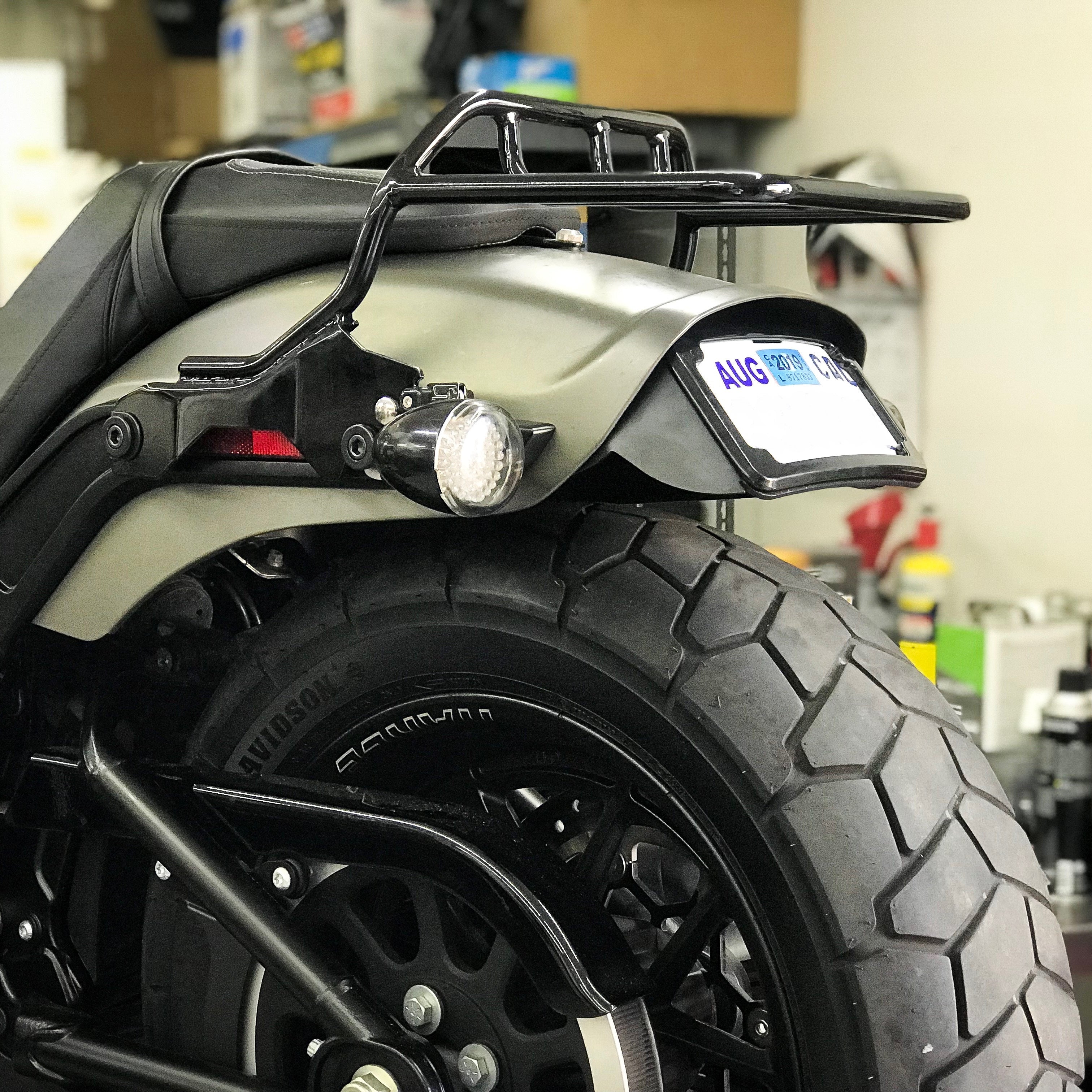 Curved License Plate Relocation For Softails