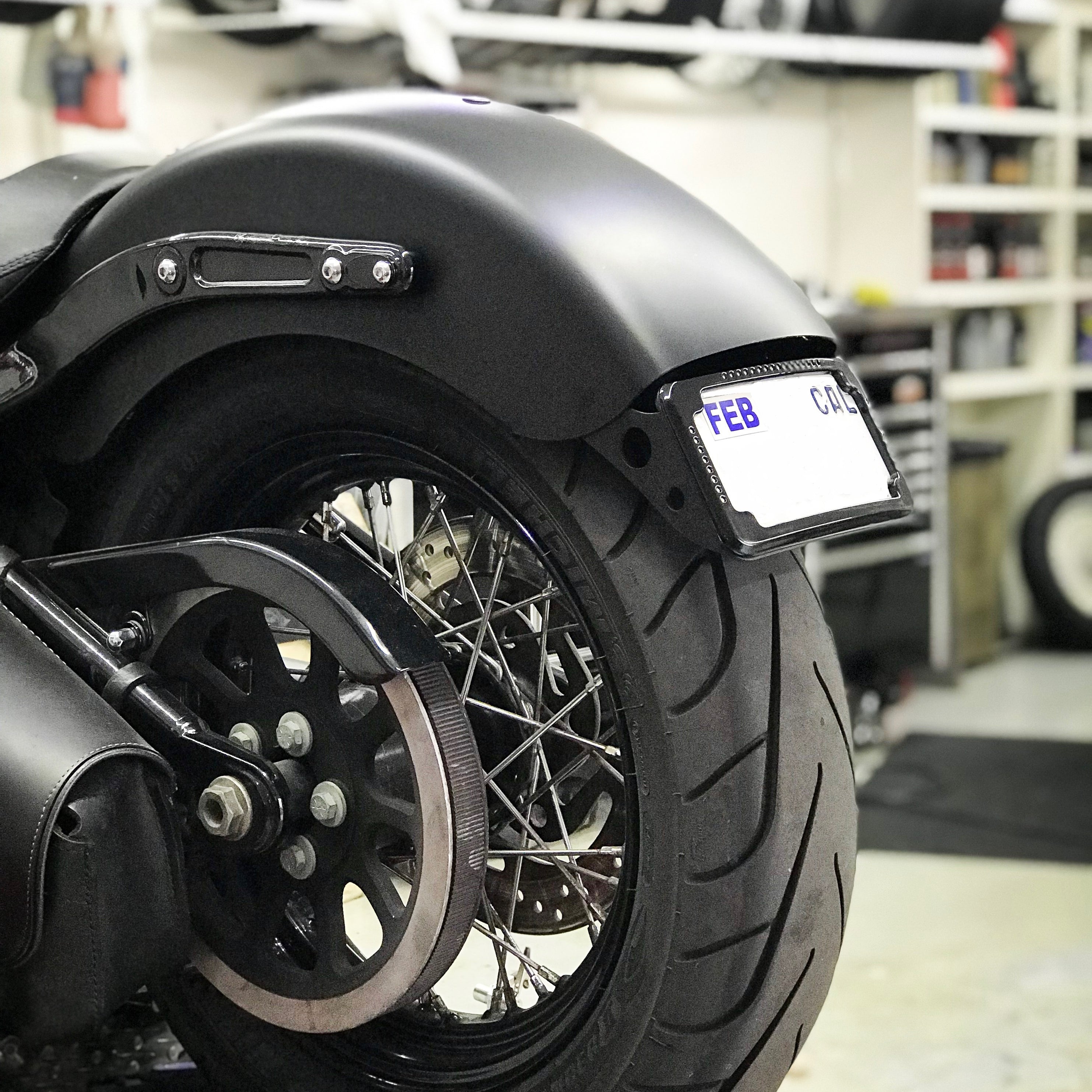 Curved License Plate Relocation For Softails