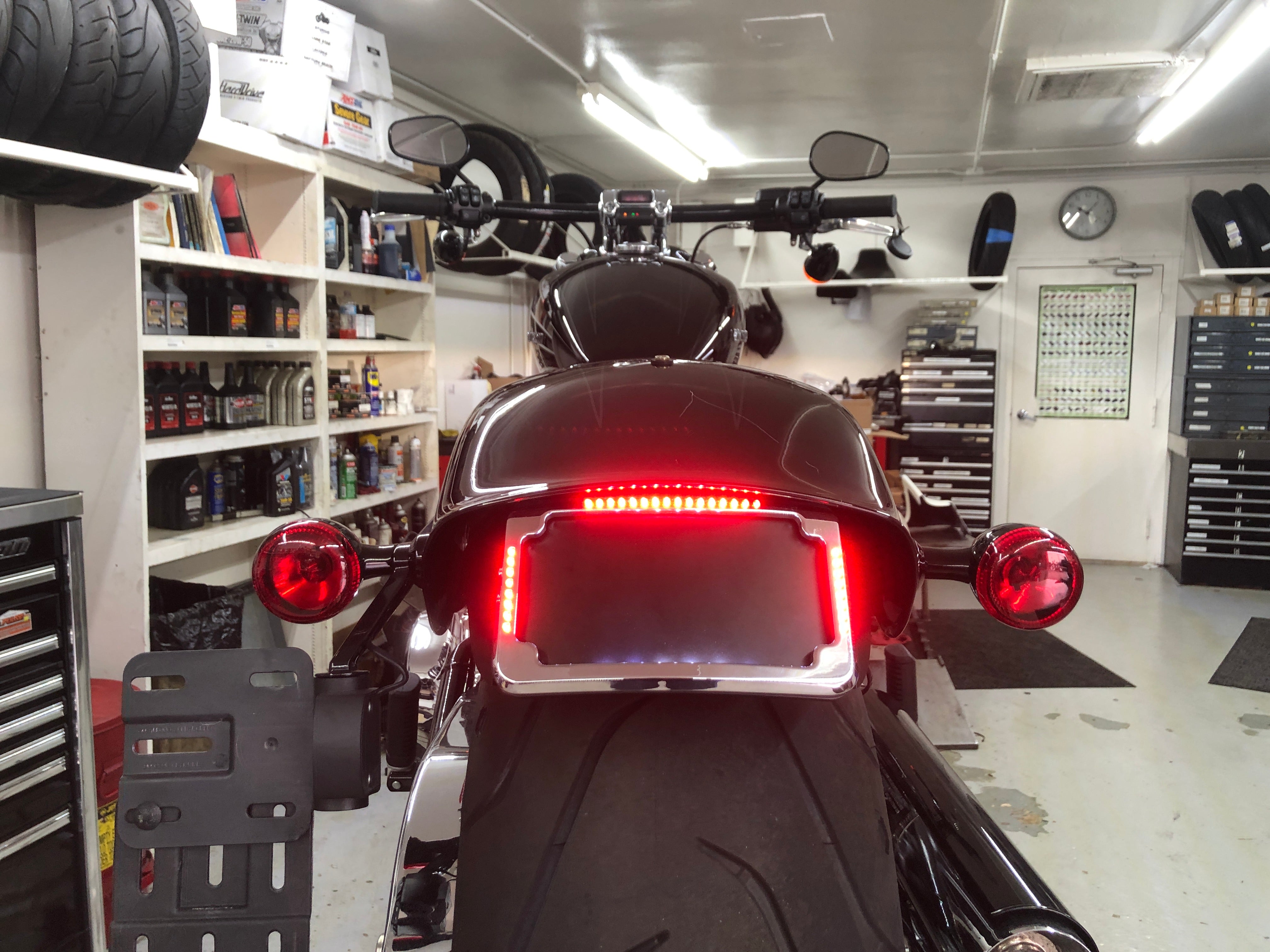 Curved License Plate Relocation For Softails