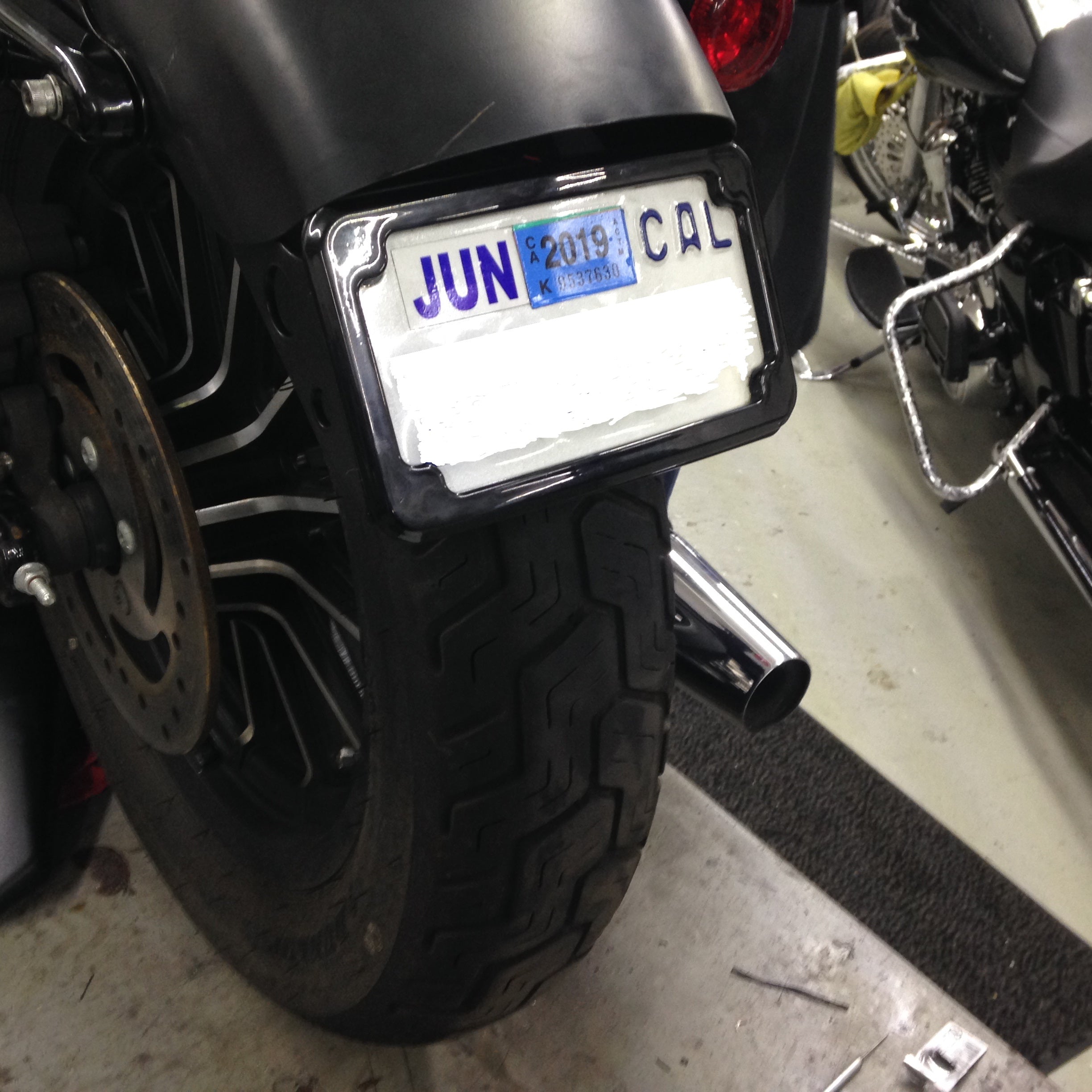 Curved License Plate Relocation for Sportsters