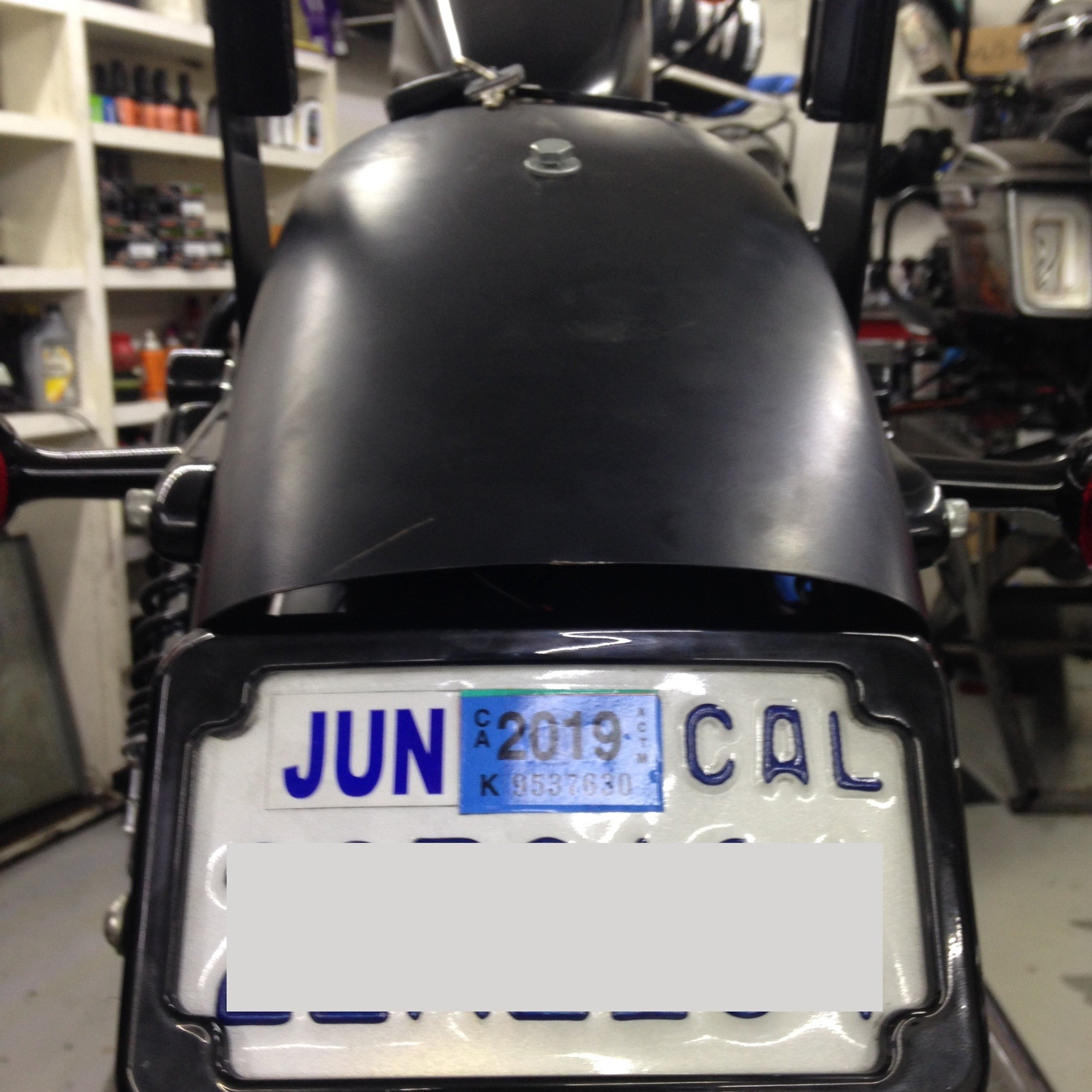 Curved License Plate Relocation for Sportsters