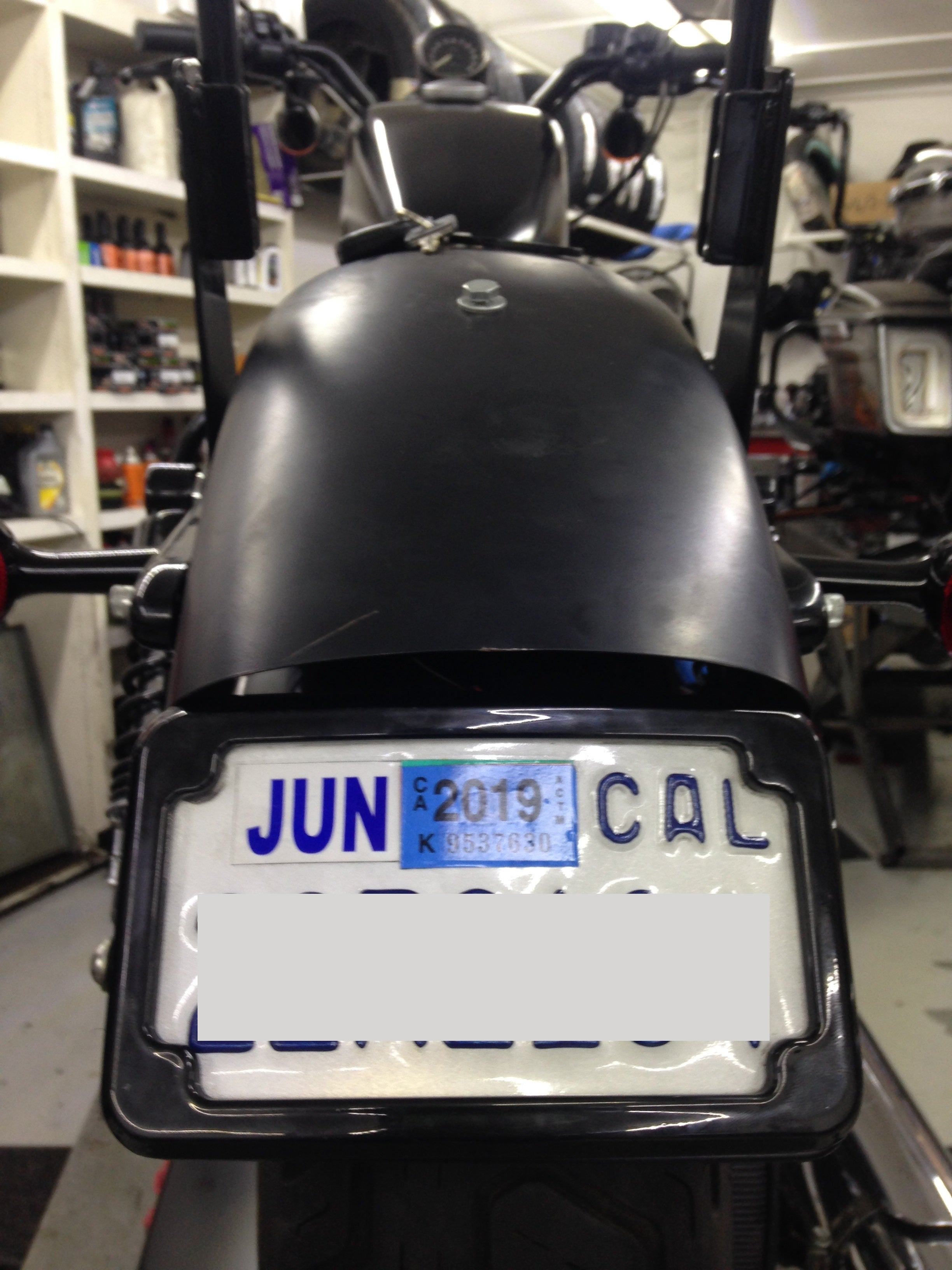Curved License Plate Relocation for Sportsters